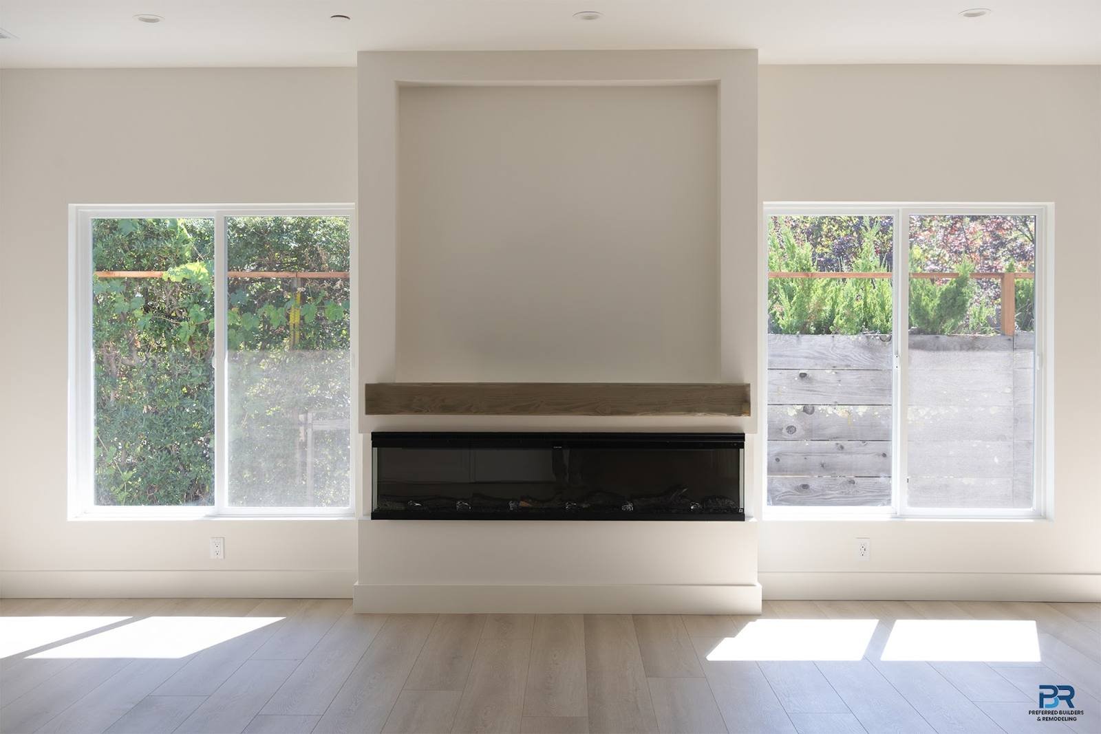 Living room with a fireplace wall in a new Walnut Creek home